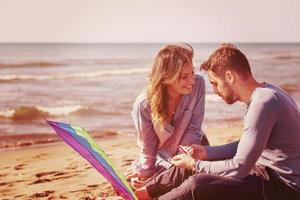 Couple enjoying time together at beach photo