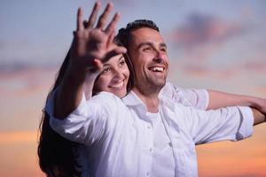 young couple  on beach have fun photo