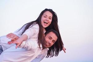 young couple  on beach have fun photo