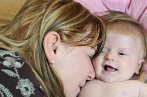 beautiful blonde young mother and cute baby photo