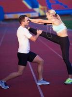 sporty woman on athletic race track photo