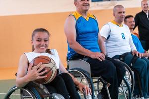 a photo of basketball teams with disabilities with the selector in the big hall before the start of the basketball game