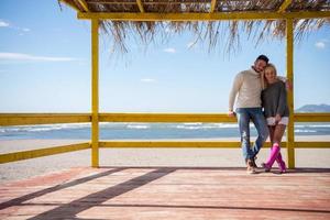 Couple chating and having fun at beach bar photo