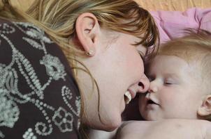 beautiful blonde young mother and cute baby photo