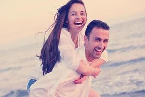 young couple  on beach have fun photo