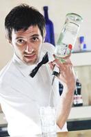 pro barman prepare coctail drink on party photo