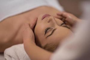 woman receiving a head massage photo