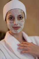 Spa Woman applying Facial Mask photo