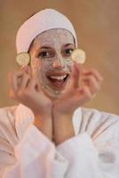 Spa Woman applying Facial Mask photo