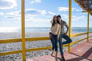 Couple chating and having fun at beach bar photo