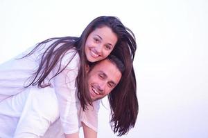 young couple  on beach have fun photo