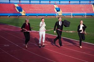 business people running on racing track photo