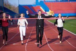 business people running on racing track photo