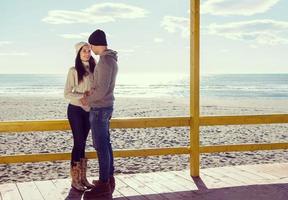 Couple chating and having fun at beach bar photo