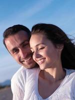 young couple  on beach have fun photo