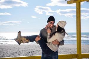 Couple chating and having fun at beach bar photo