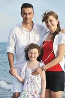 happy young family have fun on beach photo