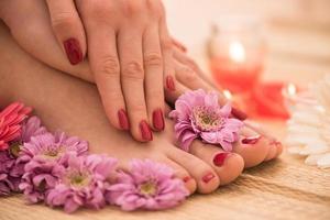 female feet and hands at spa salon photo