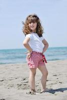 little female  child portrait on the beach photo