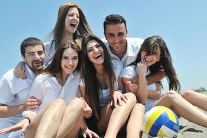 Group of happy young people in have fun at beach photo