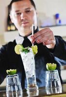 pro barman prepare coctail drink on party photo