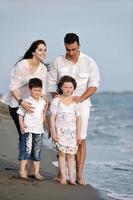 happy young family have fun on beach photo