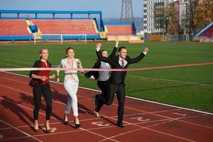 business people running on racing track photo