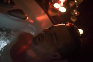 man relaxing in the jacuzzi photo