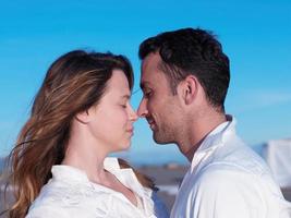 young couple  on beach have fun photo