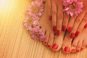 female feet and hands at spa salon photo