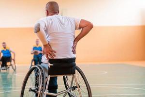 A player of the national basketball team is resting during the game in the big area. Selective focus photo