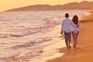 young couple  on beach have fun photo