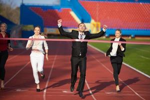 business people running on racing track photo