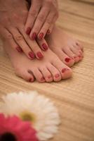 female feet and hands at spa salon photo