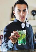 pro barman prepare coctail drink on party photo