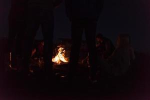 Friends having fun at beach on autumn day photo