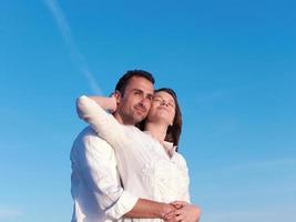 young couple  on beach have fun photo