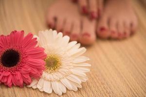 female feet and hands at spa salon photo