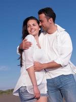 young couple  on beach have fun photo