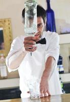 pro barman prepare coctail drink on party photo