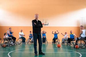 a photo of basketball teams with disabilities with the selector in the big hall before the start of the basketball game