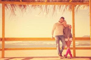 Couple chating and having fun at beach bar photo