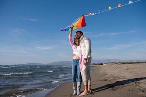 Couple enjoying time together at beach photo