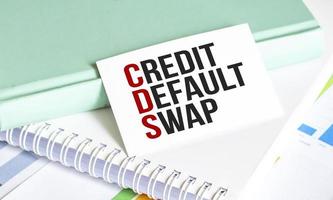 CDS Credit Default Swap - word on white sticker and charts photo