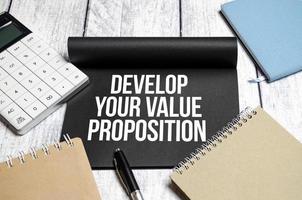 notebook with text Develop Your Value Proposition photo