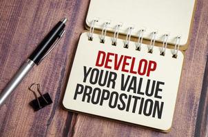 notebook with text Develop Your Value Proposition photo