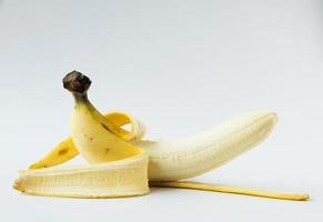 A tasty ripe banana on white background. photo