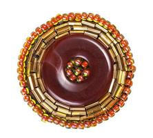 leather brooch decorated by glass beads and bugles photo