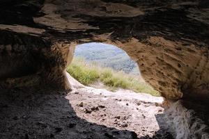 Ancient cave city, Baqla, View from inside the cave. photo