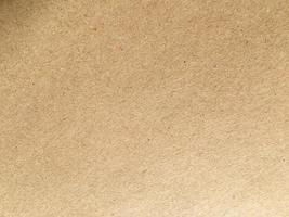 Old brown paper texture background or cardboard with copy space for design. photo